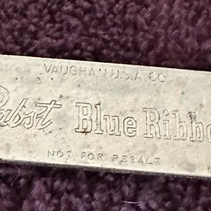 Vintage Pabst Blue Ribbon Bottle Opener can opener shows some signs of wear